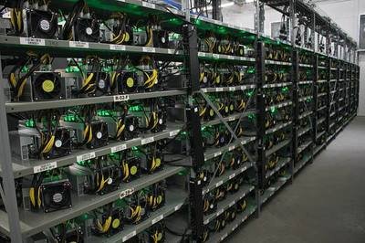 Mining farm hosting multiple Antminer rigs with hydro cooling systems