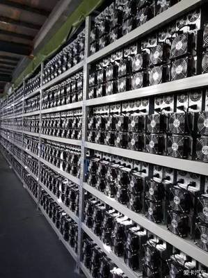 Panoramic view of a large-scale cryptocurrency mining farm with rows of mining rigs